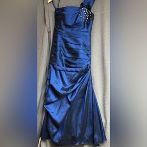 Sapphire blue, one shoulder with a bow on that shoulder, ruching down front